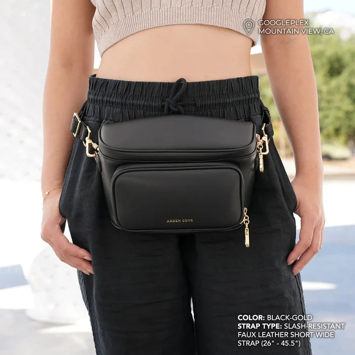 Anti-theft water-resistant Bum Bag Crossbody in black with gold hardware and slash-resistant faux leather short wide strap on model