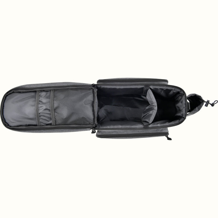 A top interior view of a gray heather bicycle trunk bag showing the large main compartment, mesh storage, two zippered exterior side pockets, and a side bottle holder, shown on a plain white background.