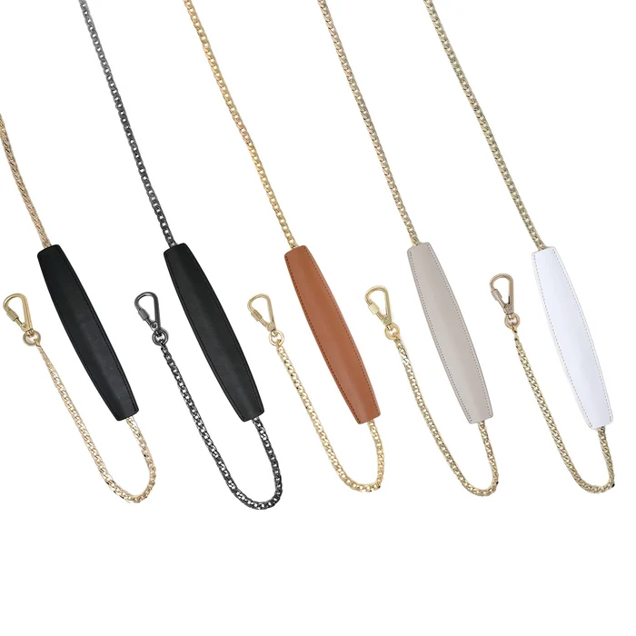 Chain straps with locking hardware and shoulder pad in all colors offered: black-gold, black-gunmetal, brown-gold, taupe-gold, and white-gold