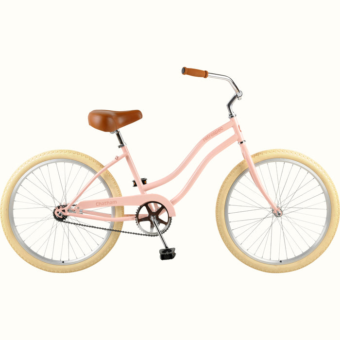 retrospec Chatham 24" girls bike in blush pink with cream tires and a brown seat.