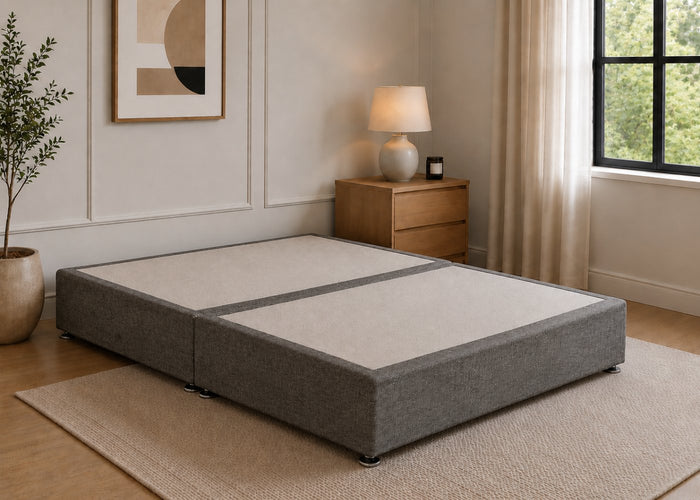 Reinforced charcoal upholstered divan base with non-slip top and silver feet.