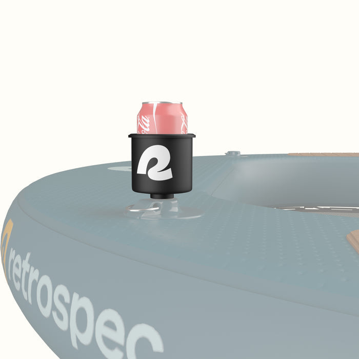 Black cup holder attached to an inflatable hammock against a white background.