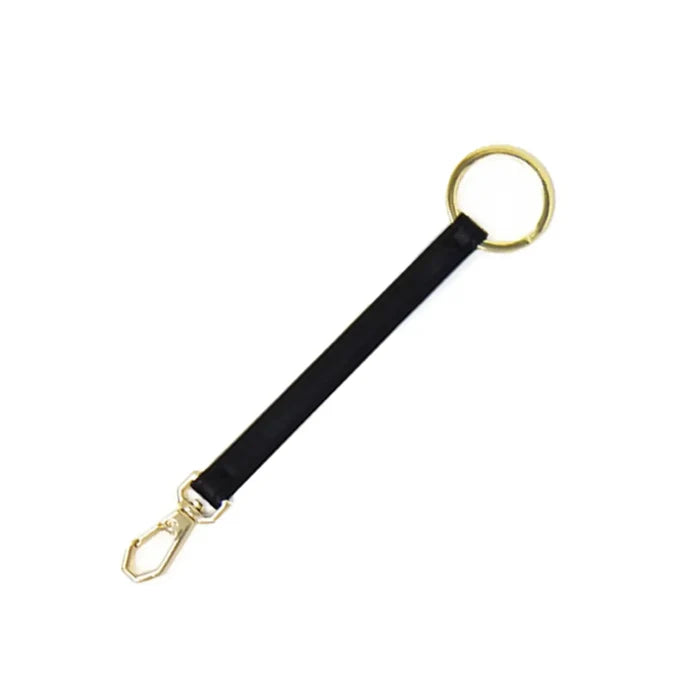 Key leash with clasp and keyring in black faux leather with gold hardware in 5.5 inches long