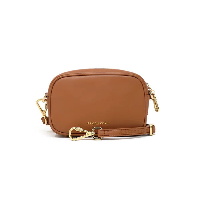 Anti-theft water-resistant Myko Crossbody in brown with gold hardware with slash-resistant faux leather straps, front view