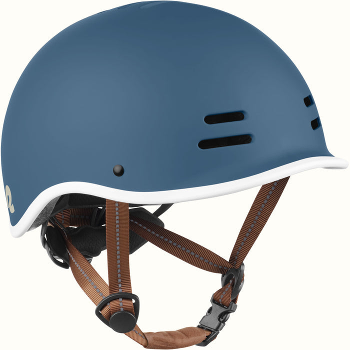 Three-quarter angle of a navy remi youth bike helmet with white trim and brown chin straps.