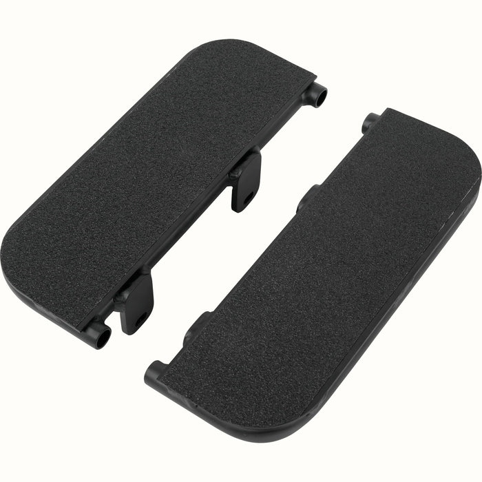 A pair of black textured footrests with mounting clips, shown on a plain white background.