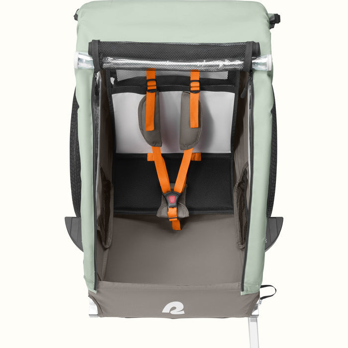 A versatile Rover Plus Kids Bike Trailer - Single with a mesh front, safety harnesses, and a seating space, designed for outdoor adventures.