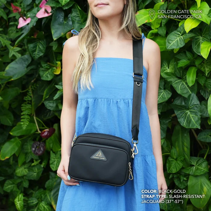 Crissy Crossbody with Slash Resistant Jacquard Strap in Locking Hardware in Black Gold modeled