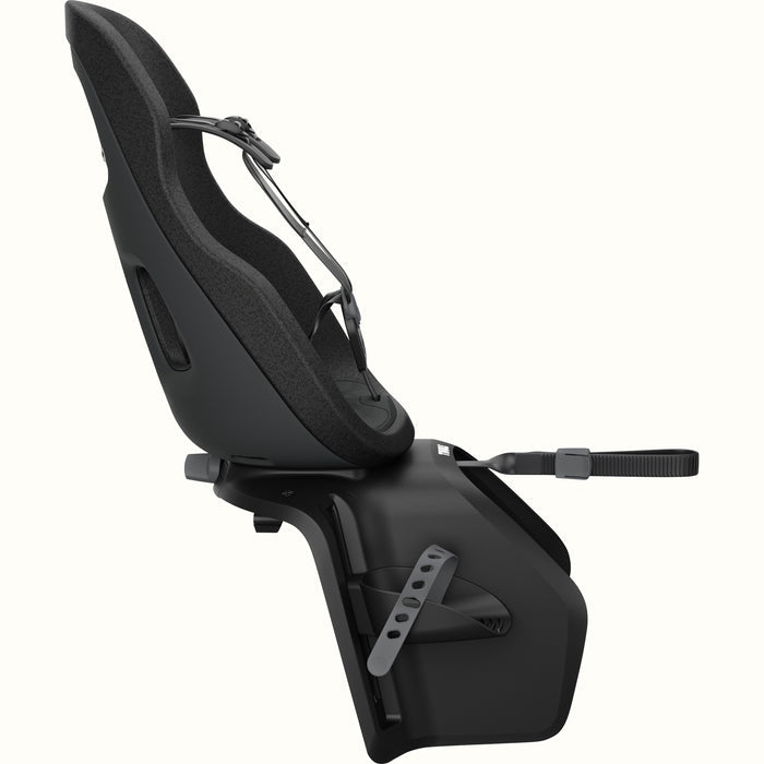 Profile view of Black Thule Yepp Nexxt 2 Maxi Child Bike Seat on a white background.