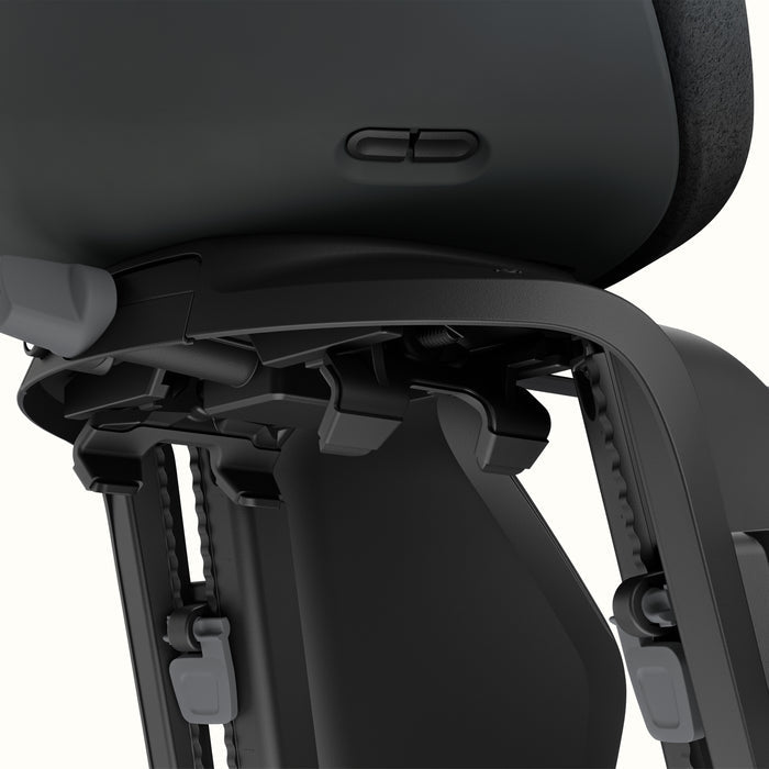 Close-up of Black Thule Yepp Nexxt 2 Maxi Child Bike Seat on a white background.