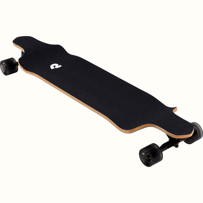 A sleek, black longboard skateboard with a grip surface and sturdy wheels, positioned diagonally on a light background.